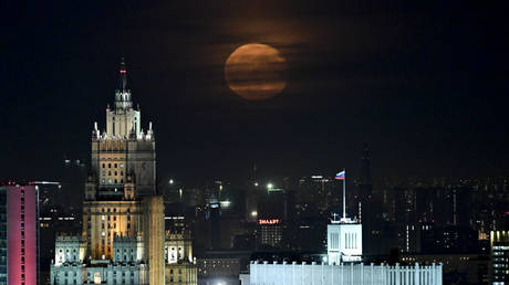 A full moon rises over the Ministry of Foreign Affairs building and the Prime Minister's office in Moscow, Russia, May 24, 2024