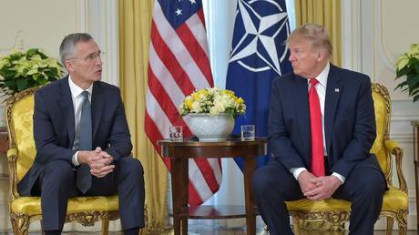 FILE PHOTO: US President Donald Trump meets NATO Secretary General Jens Stoltenberg in December, 2019.