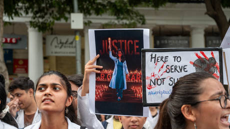 The resident doctors hold placards during a protest against the brutal rape and murder of a postgraduate trainee doctor from Kolkata's RG Kar Hospital.