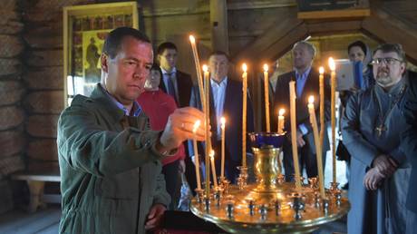 FILE PHOTO: Dmitry Medvedev attends a church service in 2015.