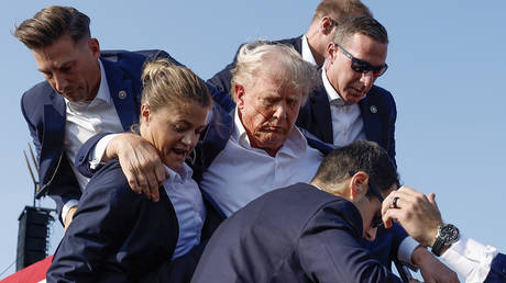 File photo: Republican presidential candidate Donald Trump is rushed offstage by US Secret Service agents after being grazed by a bullet during a rally in Butler, Pennsylvania on July 13, 2024.