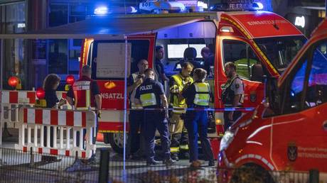 Firefighters and police officers respond to a stabbing attack in Solingen, Germany on August 24, 2024.