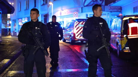 Police and ambulances stand near the crime scene in Solingen, Germany on August 23, 2024