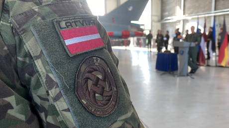 File Photo: Latvian service member wearing a patch of Latvia's flag, March 2, 2024.