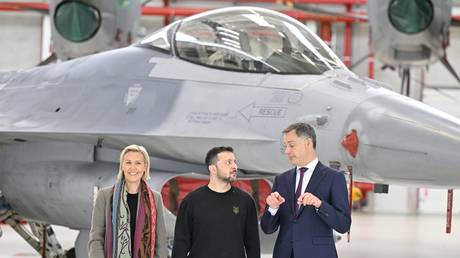 Belgian Defense Minister Ludivine Dedonder, Belgian PM Alexander De Croo, and Ukrainian leader Vladimir Zelensky at Melsbroek Air Base, Brussels, Belgium, May 28, 2024.