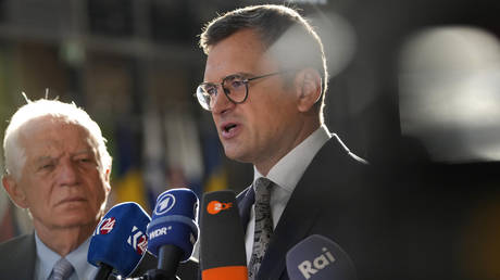 European Union foreign policy chief Josep Borrell (left) and Ukrainian Foreign Minister Dmytro Kuleba speak to the media as they arrive for a meeting of EU foreign ministers at the European Council building in Brussels, Thursday, Aug. 29, 2024.