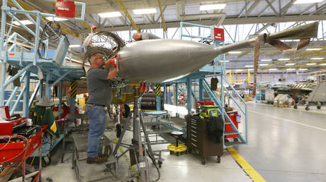 FILE PHOTO: An aircraft mechanic works on an F-16 at Hill Air Force base in Ogden, Utah.