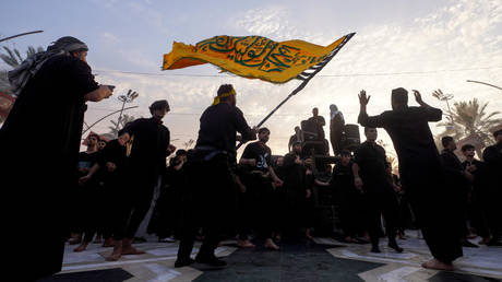 Thousands take part in a mourning event to mark Arbaeen in Iraq's southern city of Karbala on August 24, 2024.