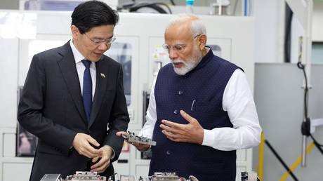 Indian Prime Minister Narendra Modi interacts with his Singapore counterpart Lawrence Wong during a recent state visit