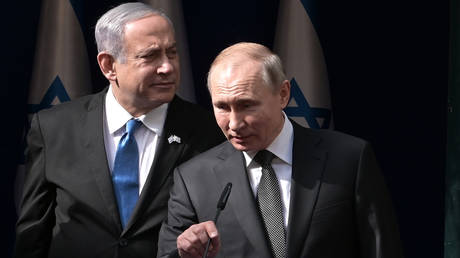 Russian President Vladimir Putin and Israeli Prime Minister Benjamin Netanyahu (left).