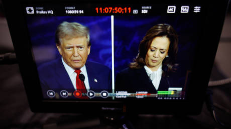 Donald Trump and Kamala Harris, Republican and Democratic presidential nominees, are seen on a screen as they debate at The National Constitution Center on September 10, 2024 in Philadelphia, Pennsylvania.