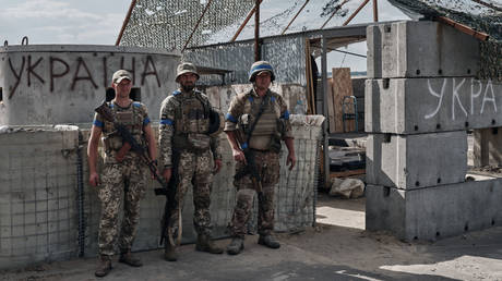 Ukrainian military personnel man a checkpoint in Sudzha, Russia, August 16, 2024