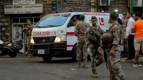 Troops secure the area for an ambulance to enter a hospital amid a wave of explosions of electric devices across Lebanon.