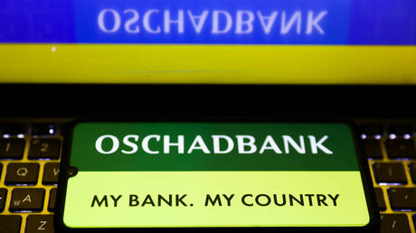 Oschadbank logo on a mobile phone screen.