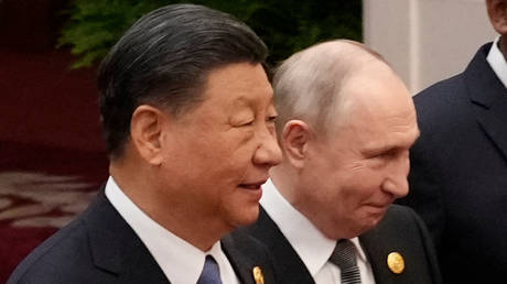 Chinese President Xi Jinping and Russian President Vladimir Putin prepare for a group photo at the Third Belt and Road Forum on October 18, 2023 in Beijing, China.