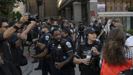 Police respond as a pro-Palestinian protester sets himself on fire near the White House in Washington DC, October 5, 2024