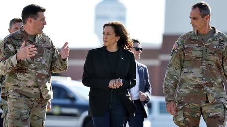 FILE PHOTO: Vice President Kamala Harris and members of the US armed forces.