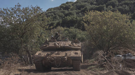 FILE PHOTO: Israeli tanks gather along the Israeli-Lebanese border.