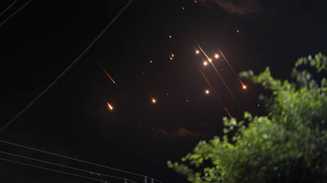 FILE PHOTO: Missiles launched from Iran towards Israel, as seen from Deir al-Balah, Gaza, October 1, 2024