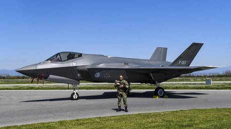  A Dutch soldier guards an F-35 fighter jet of the Royal Netherlands Air Force in Bulgaria.