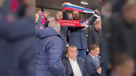 Serbian leader brandishes Russian flag