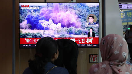 North Korea blowing up a section of an inter-Korean road seen on a TV at Seoul station in South Korea, October 15, 2024.