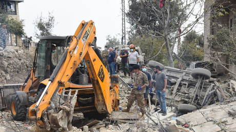 Rescuers work at the site of an Israeli airstrike in the village of Aitou, northern Lebanon, October 15.