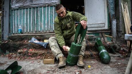  A Ukrainian soldier prepares ammunition to be used with drones.