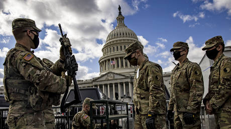  Virginia National Guard soldiers are issued their M4 rifles and live ammunition on the east front of the US Capitol on January 17, 2021 in Washington, DC