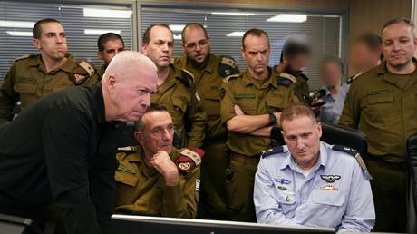 Israeli Defense Minister Yoav Gallant (1st L, front) at the Israeli Air Forces underground command room September 27, 2024.