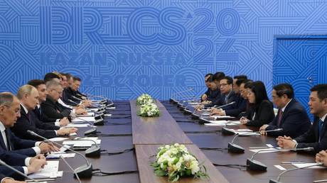 President of Russia Vladimir Putin and Prime Minister of Vietnam Pham Minh Chinh during their meeting on the sidelines of the 16th BRICS Summit in Kazan, Russia.