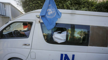 File photo: Two UNRWA staffers killed by an Israeli strike on their vehicle are transported to a Gaza hospital, October 23, 2024.