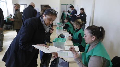 FILE PHOTO: Georgians cast their votes at a polling station in Tbilisi on October 26, 2024.