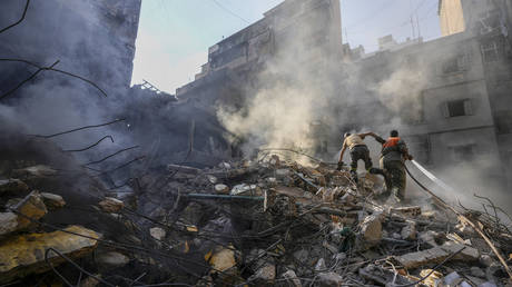 FILE PHOTO. Rescue workers search for victims at the site of Thursday's Israeli airstrike in Beirut, Lebanon.