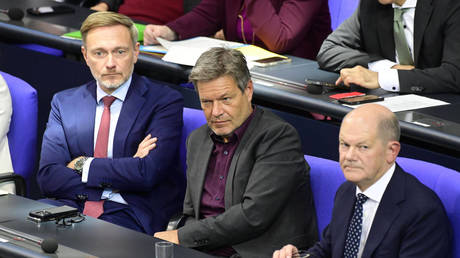 FILE PHOTO: Finance Minister Christian Lindner (L), Economy Minister Robert Habeck (C) and Chancellor Olaf Scholz (R) are seen at the session of the German Bundestag in Berlin, Germany, on October 16, 2024.