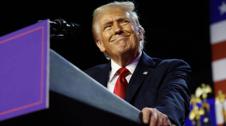 Republican presidential nominee, former US President Donald Trump arrives to speak during an election night event at the Palm Beach Convention Center on November 6, 2024 in West Palm Beach, Florida.