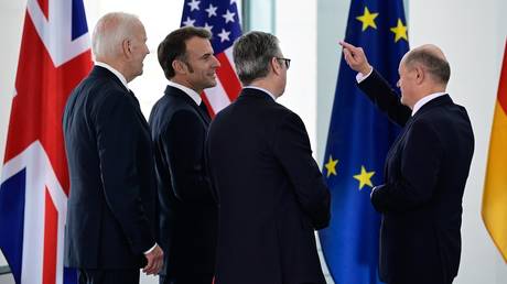 FILE PHOTO: German Chancellor Olaf Scholz (R), US President Joe Biden (L), French President Emmanuel Macron (2ndL), and British Prime Minister Keir Starmer in Berlin, Germany.