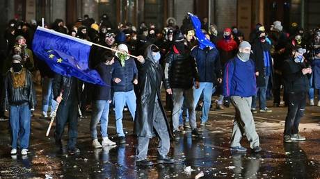 Supporters of the Georgian opposition attend a protest against the results of last month's parliamentary elections in Tbilisi, Georgia