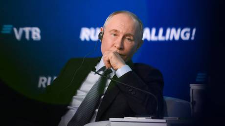 Russian President Vladimir Putin attends a plenary session of the 15th VTB Investment Forum "Russia Calling!" at the World Trade Centre in Moscow, Russia.