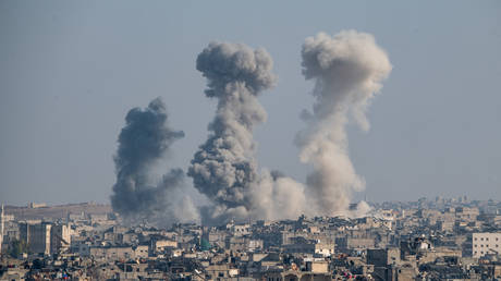 FILE PHOTO: Thick columns of smoke were seen rising over the city of Aleppo, following a series of airstrikes conducted by Syrian warplanes.