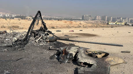 Wreckage seen at the site of an Israeli airstrike at Mezzeh Air Base in Damascus, Syria, December 9, 2024