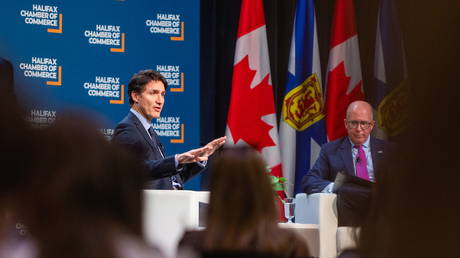 Prime Minister Justin Trudeau, left, speaks at a Halifax Chamber of Commerce event in Dartmouth, Canada, on December 9, 2024.