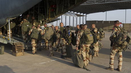 FILE PHOTO: French soldiers prepare to board on a fighter plane at Kossei camp at the French military base of N'Djamena in Chad.