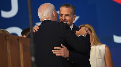 FILE PHOTO: US President Joe Biden embraces his son Hunter Biden