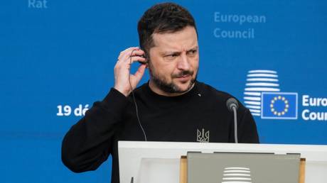 Ukrainian leader Vladimir Zelensky  talks to media at the end of an EU Summit meeting in Brussels.