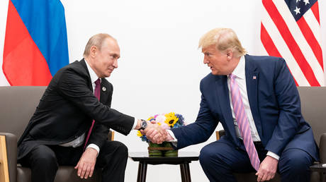 FILE PHOTO: Russian President Vladimir Putin and then-US President Donald Trump on the sidelines of the G20 Summit in Osaka, Japan, June 28, 2019.