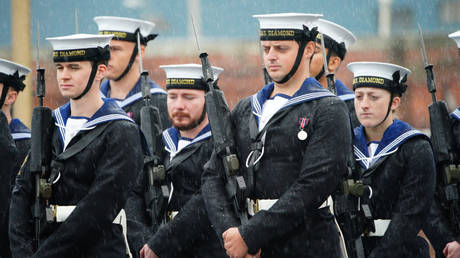 Royal Navy crew from HMS Diamond stand on parade in the rain at Portsmouth Historic Dockyard, in Hampshire. Picture date: Thursday September 5, 2024.