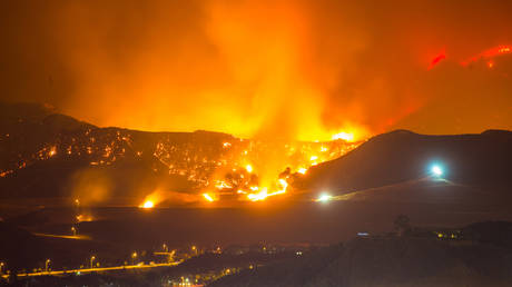 Night long exposure photograph of the Santa Clarita wildfire - stock photo