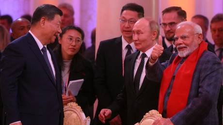 FILE PHOTO: From left: President of China Xi Jinping, President of Russia Vladimir Putin and Prime Minister of India Narendra Modi during a concert ahead of an informal lunch for the heads of BRICS delegations held as part of the 16th BRICS summit in Kazan.