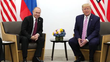 FILE PHOTO. US President-elect Donald Trump (R) meets Russian President Vladimir Putin (L).